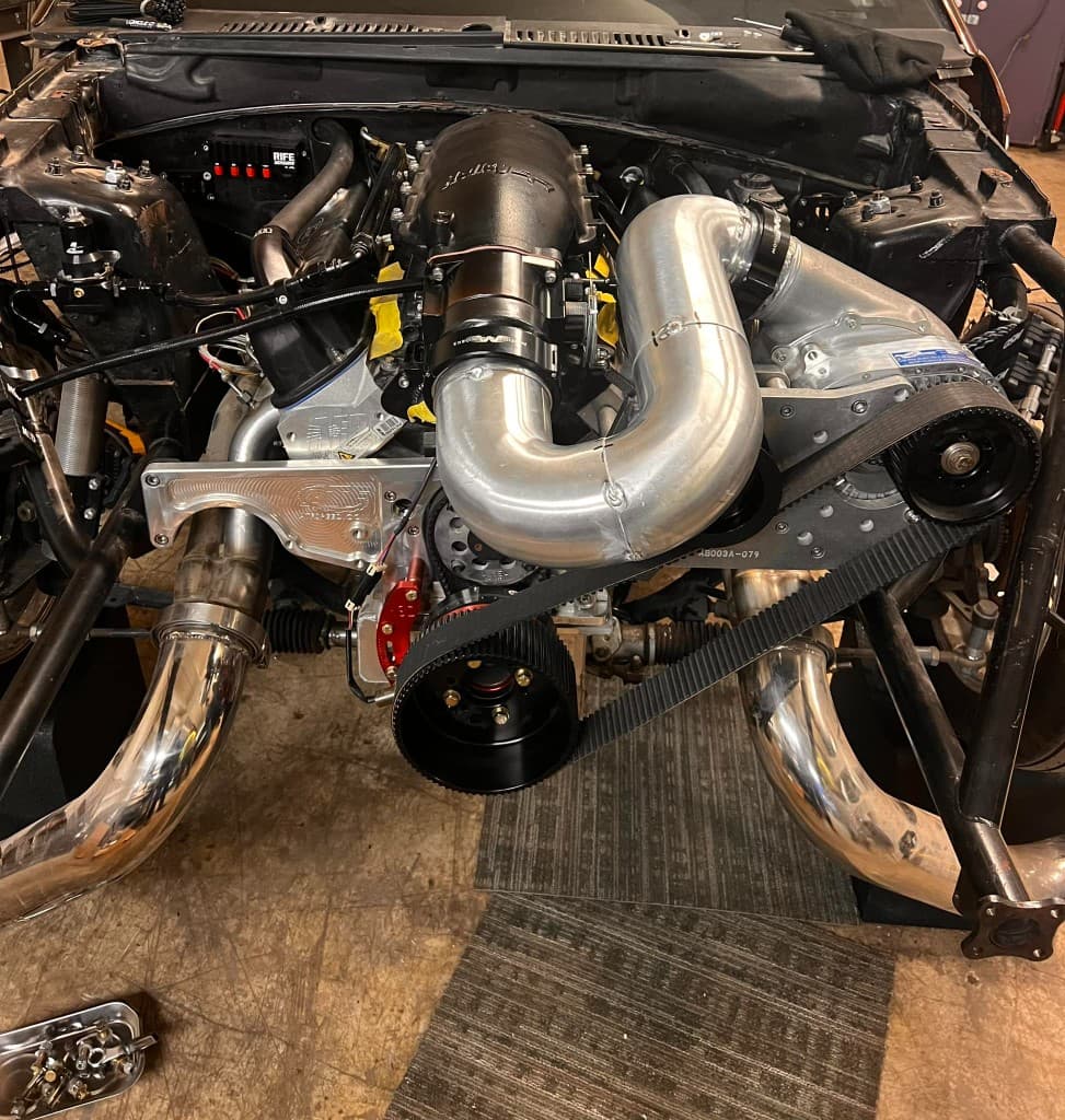 Polished ProCharger and serpentine drive on a Fox body build
