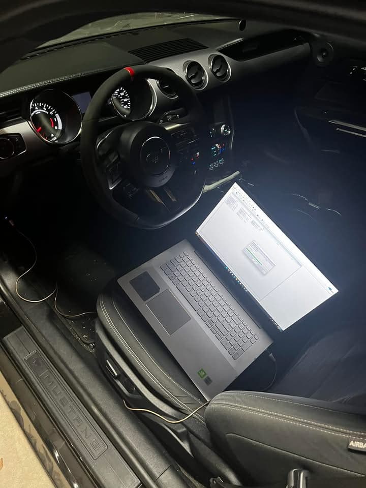 Laptop tuning a 2024 Mustang from the driver seat