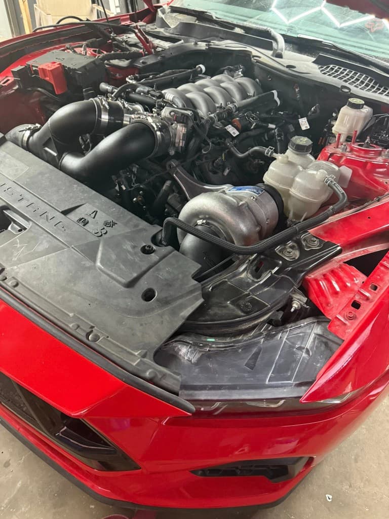 Procharger setup on a red 2024 Mustang