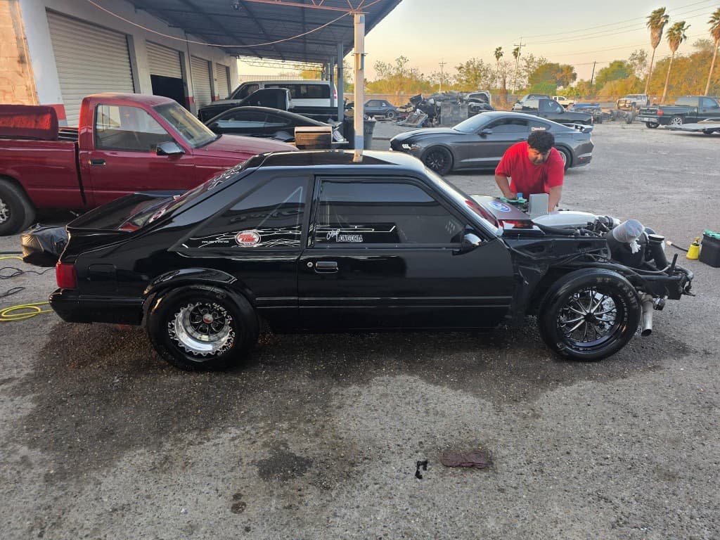 Black drag-prepped Fox body Mustang at the shop